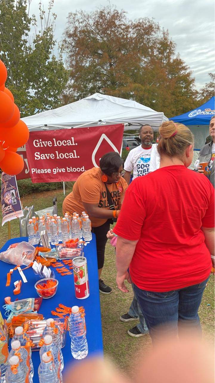 Community Hands of Hope team at outdoor awareness campaign